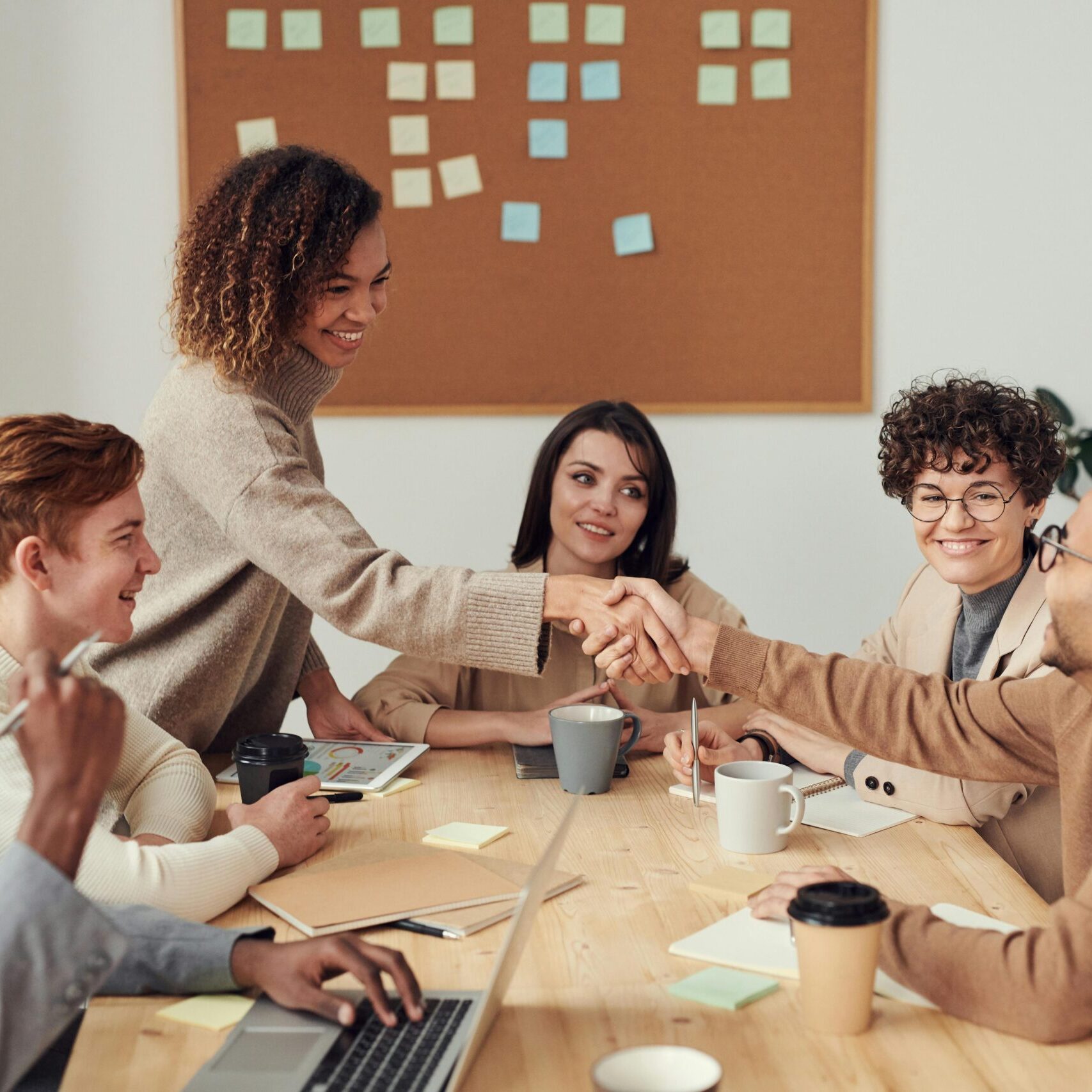 Professionals discussing strategy at a whiteboard Professionals discussing strategy at a whiteboard